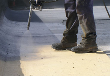 Coating systems over New Orleans spray foam roof systems